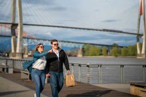 couple walking on the boardwalk in New Westminster