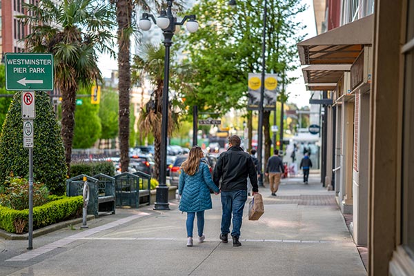 couple walking in downtown new west